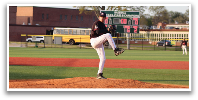 A baseball player in a black shirt and white pants is pitching a ball. Description generated by AI