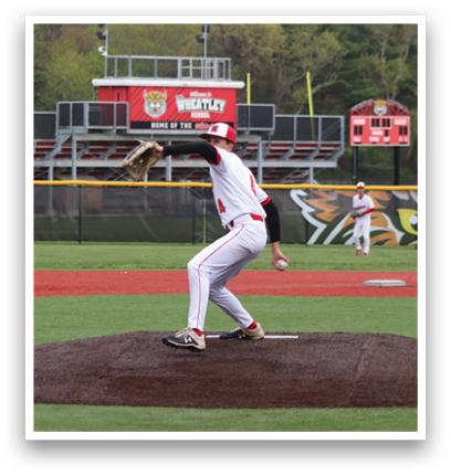 A baseball player in a white and red uniform is pitching a ball. Description generated by AI
