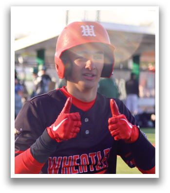 A baseball player wearing a black and red shirt and white pants. Description generated by AI