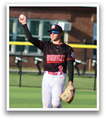 A baseball player wearing a black and red shirt and white pants. Description generated by AI