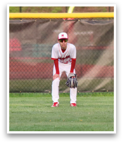 A baseball player in a white uniform and red helmet. Description generated by AI