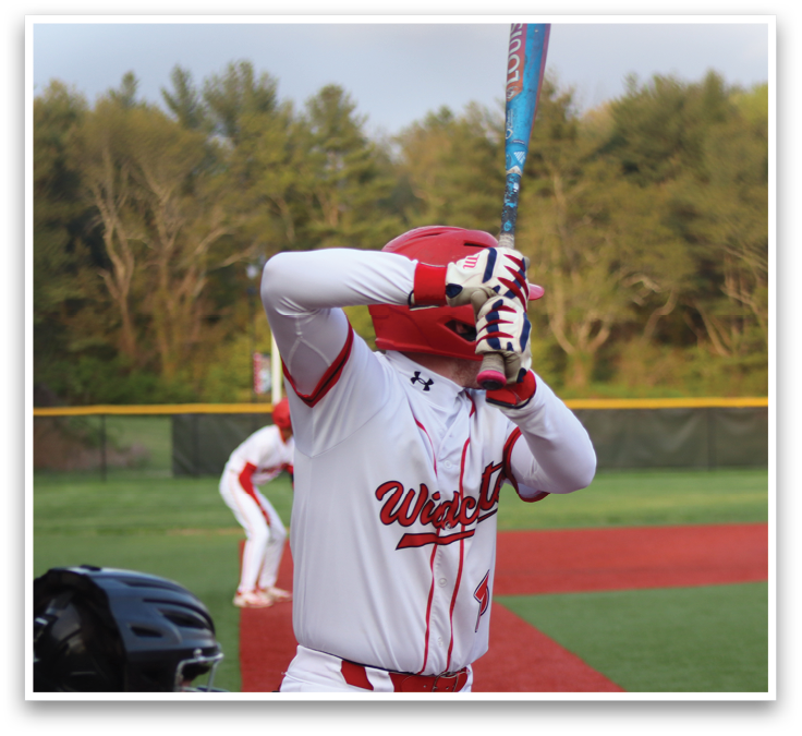 A baseball player in a red and white uniform is running to first base. Description generated by AI