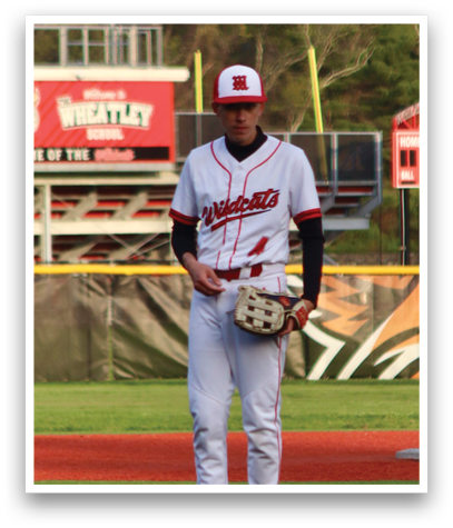 A baseball player in a white uniform and red helmet. Description generated by AI