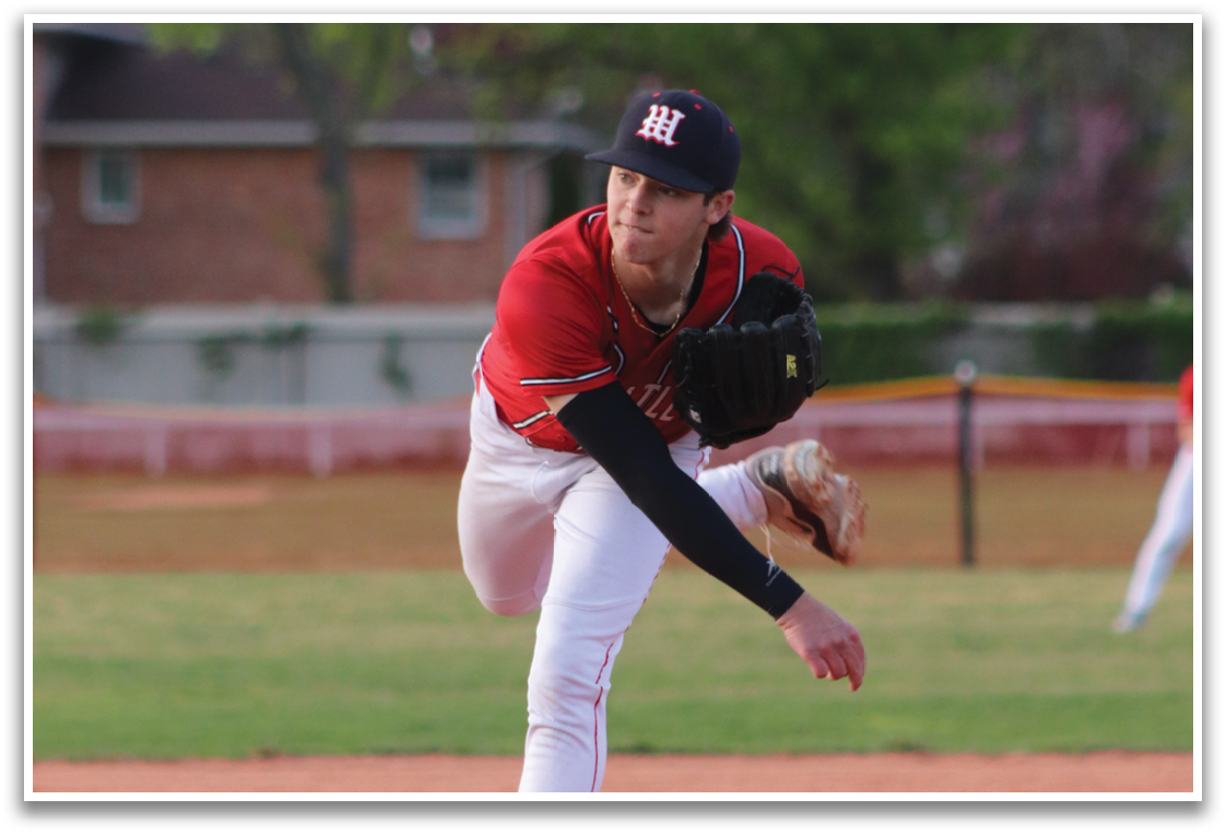 A baseball player wearing a red shirt and white pants is running towards a base. Description generated by AI