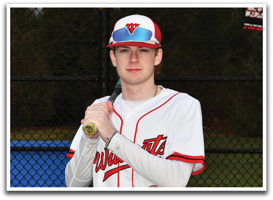 A baseball player wearing a red and white uniform. Description generated by AI