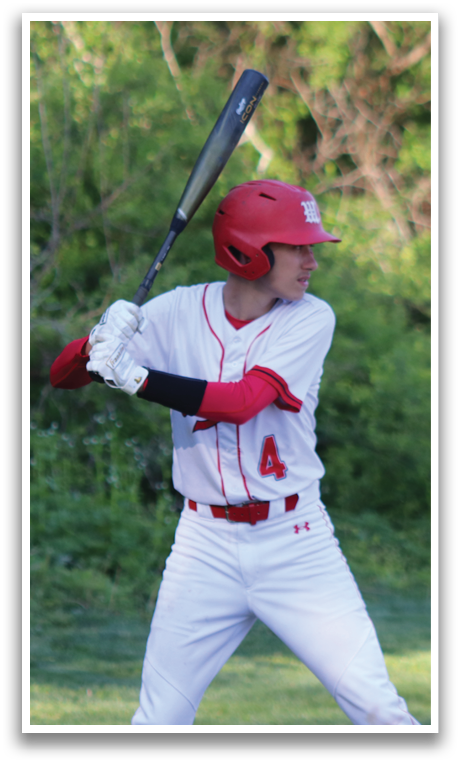 A man in a red and white baseball uniform is holding a bat. Description generated by AI