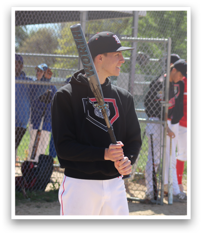 A man holding a baseball bat. Description generated by AI