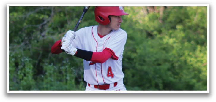 A man in a red and white baseball uniform is holding a bat. Description generated by AI