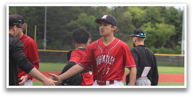 A group of baseball players on a field. Description generated by AI