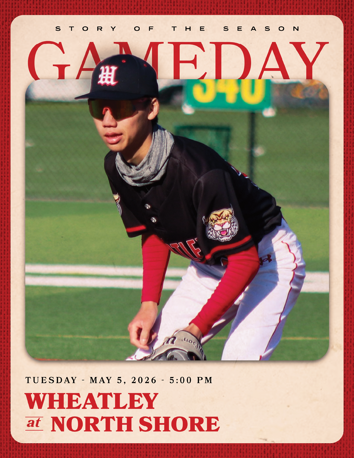 A baseball player wearing a black and red jersey. Description generated by AI