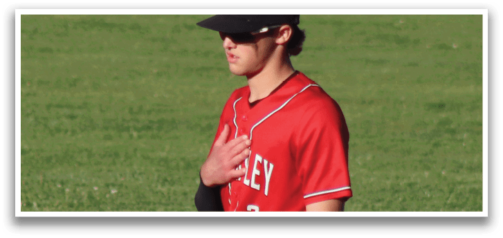 A baseball player with a mitt on his hand. Description generated by AI