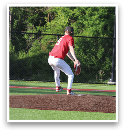A baseball player is pitching a ball on a field. Description generated by AI