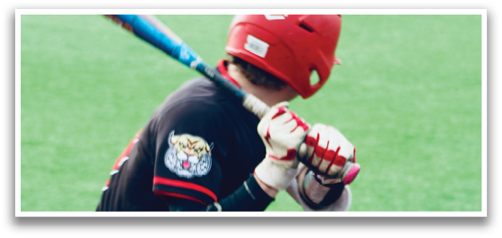 A baseball player is swinging a bat at a ball. Description generated by AI