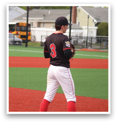A baseball player is standing on the field. Description generated by AI