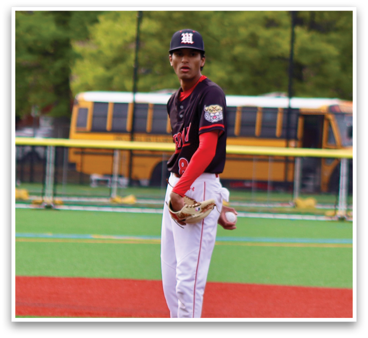A baseball player is standing on a pitcher's mound. Description generated by AI