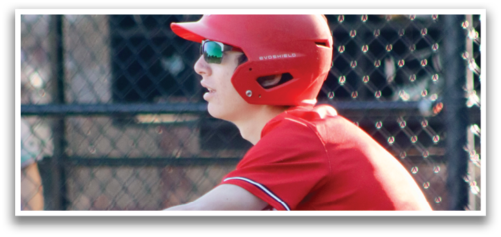 A baseball player in a red shirt and white pants is swinging a bat. Description generated by AI