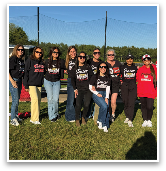 A group of people wearing black shirts and jeans. Description generated by AI