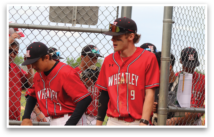 A group of people wearing red and white jerseys. Description generated by AI
