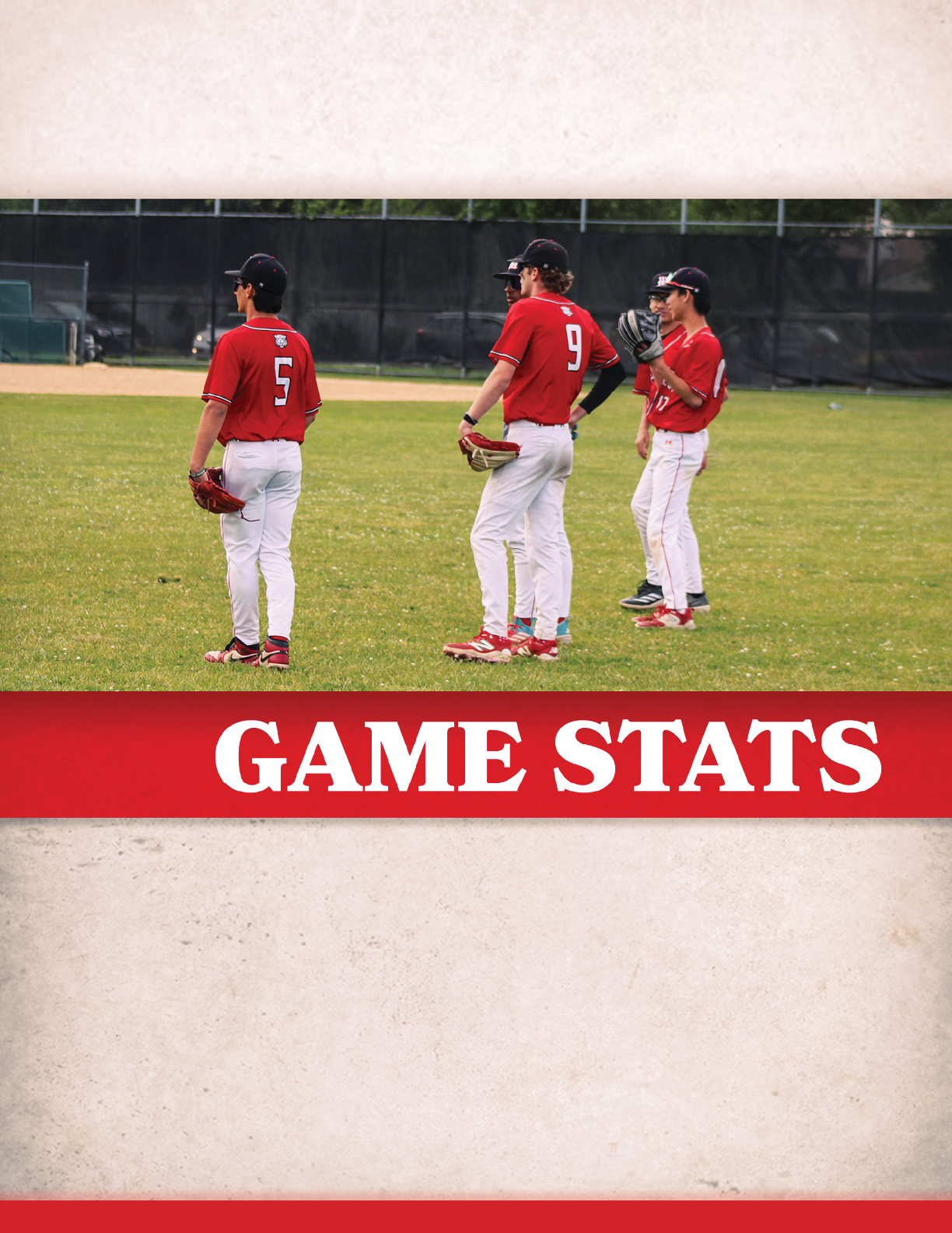 A group of baseball players standing on a field. Description generated by AI