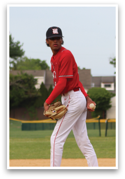 A baseball player on the field wearing a red shirt and white pants. Description generated by AI