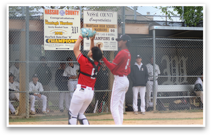A baseball player catching a ball. Description generated by AI