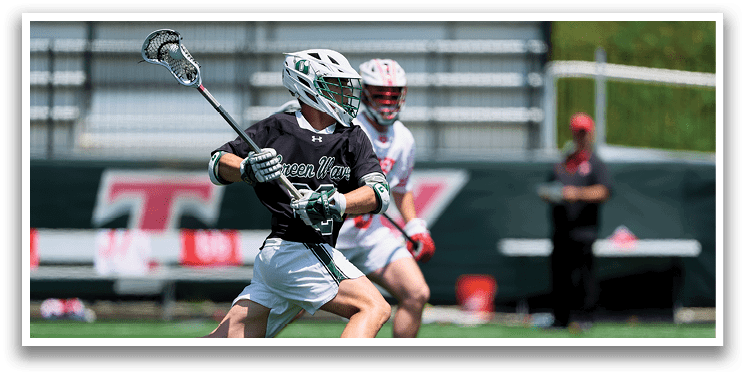 A man in a black jersey is running with a lacrosse stick, chasing another player. AI generated content