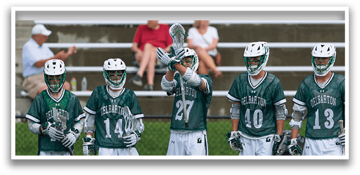 A group of lacrosse players standing on a field with their sticks in the air. AI generated content