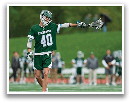 A man wearing a green jersey with the number 40 on it is holding a lacrosse stick. AI generated content