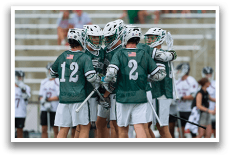 A group of men wearing green shirts and white shorts are huddled together on a field. AI generated content
