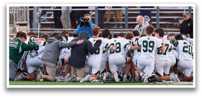 A group of young men are kneeling on a field, praying together. AI generated content