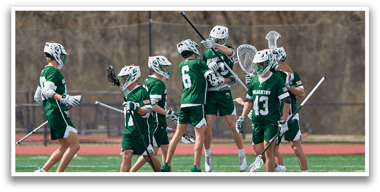 Two men playing lacrosse, one with a stick in the air, the other trying to block him. AI generated content