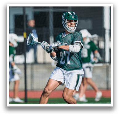 A man in a black and white uniform is running on a field with a lacrosse stick. AI generated content