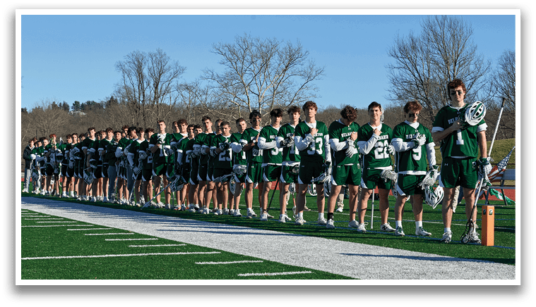 A group of young men in uniforms are standing on a field, holding their lacrosse sticks. AI generated content