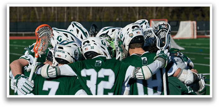 A group of lacrosse players huddle together on a field. AI generated content