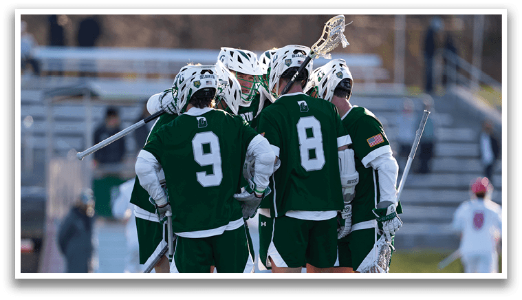 A group of men wearing green jerseys are huddled together on a field. AI generated content