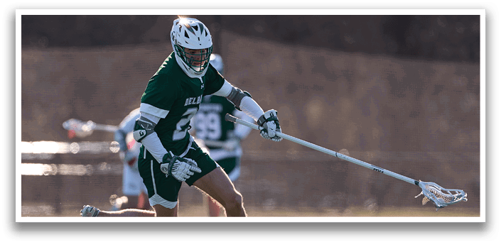 A man in a green and white uniform is running on a field with a lacrosse stick in his hand. AI generated content