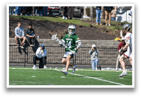 A group of people are playing a game of lacrosse on a field. AI generated content