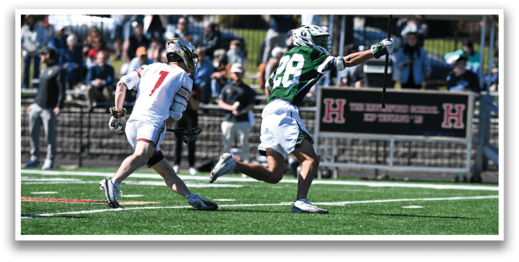 Two men playing a game of football on a field. One man is running with the ball while the other is trying to catch him. AI generated content