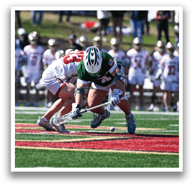 Two female lacrosse players are on the field, one with a stick in her hand, and the other with a stick in her hand and a ball. They are both wearing green and white uniforms. AI generated content