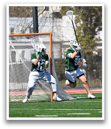 Two men playing lacrosse on a field, one of them is holding a stick. AI generated content