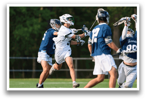 A group of men playing a game of lacrosse. Description generated by AI