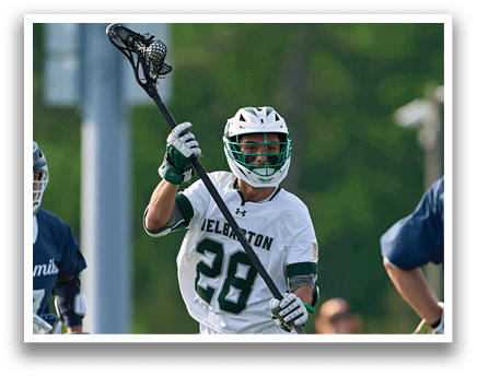 A man wearing a white jersey with the number 28 on it. Description generated by AI