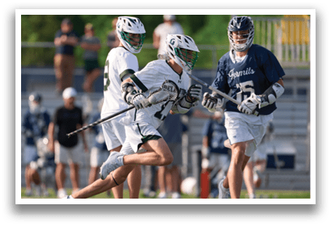 A group of people playing a game of lacrosse. Description generated by AI