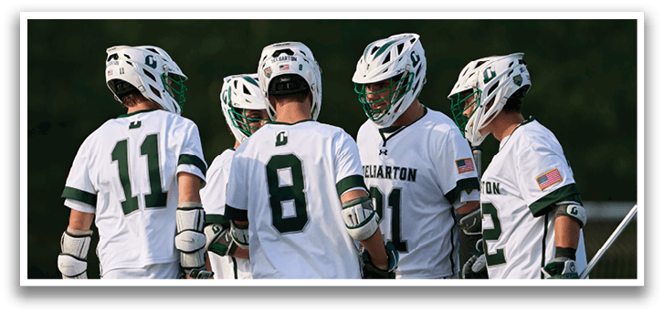 A group of lacrosse players wearing green and white uniforms. Description generated by AI