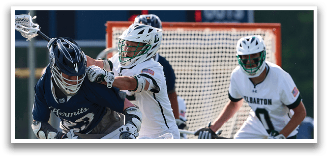 A group of people playing lacrosse. Description generated by AI