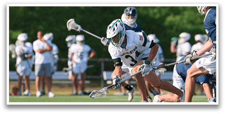 A man is playing lacrosse and is about to hit the ball. Description generated by AI