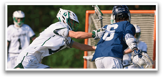 Two men playing lacrosse. Description generated by AI