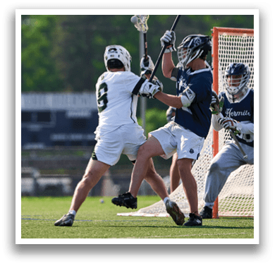 A group of men playing lacrosse. Description generated by AI