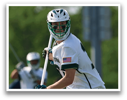A man wearing a white shirt and white shorts holding a baseball bat. Description generated by AI