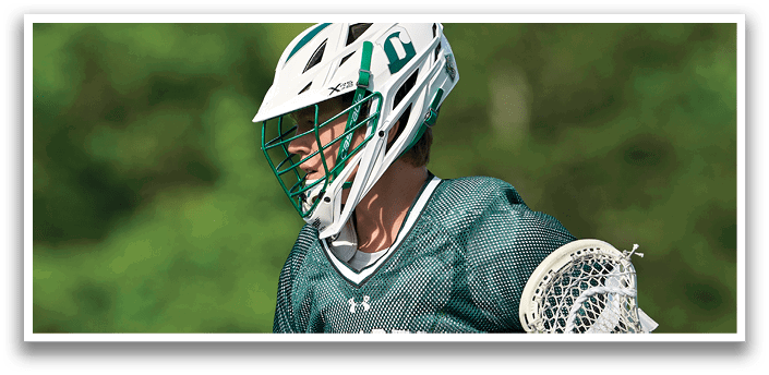 A man wearing a green and white jersey with the number 35 on it. Description generated by AI